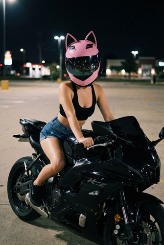 Prompt for AI Image: Fit Female Biker Rides Motorcycle