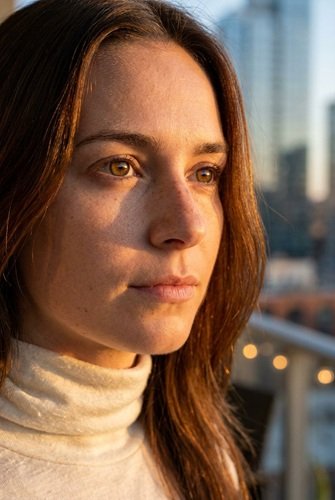 AI Image: Portrait of a Young Brunette Woman in a City